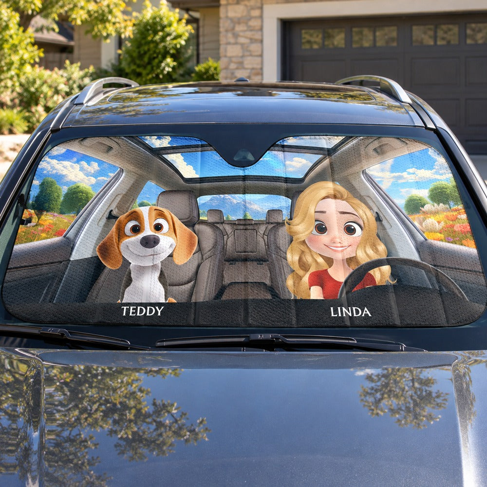 Personalized dog and owner auto windshield sunshade installed in a parked SUV on a sunny day