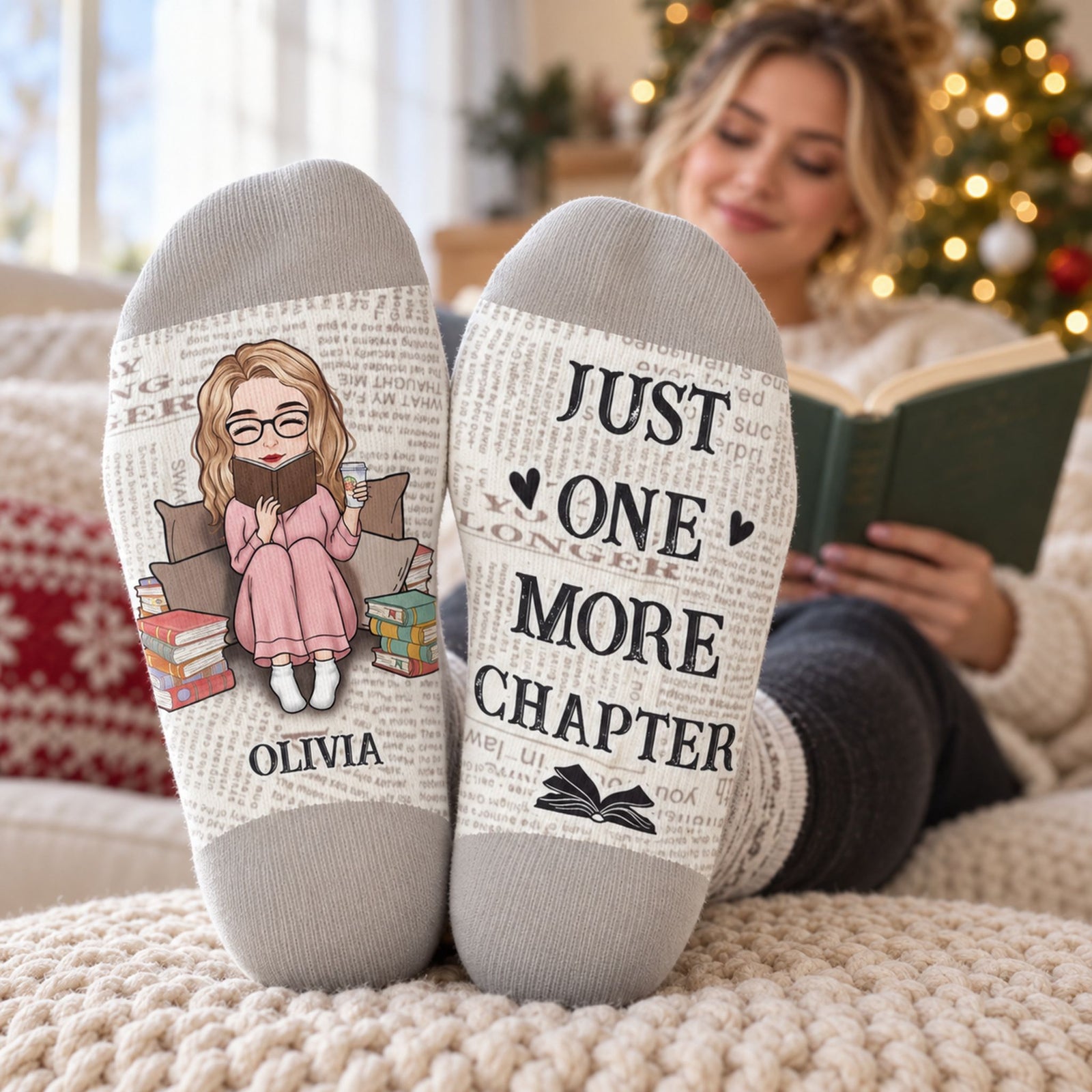 Woman wearing custom book lover crew socks showing printed soles while reading on a cozy sofa