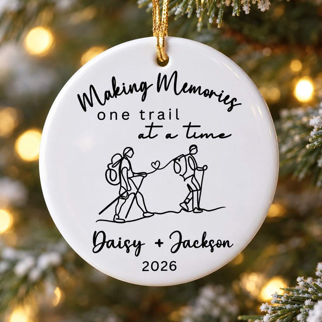 Close-up detail of the glossy ceramic finish and black line art on the hiking ornament