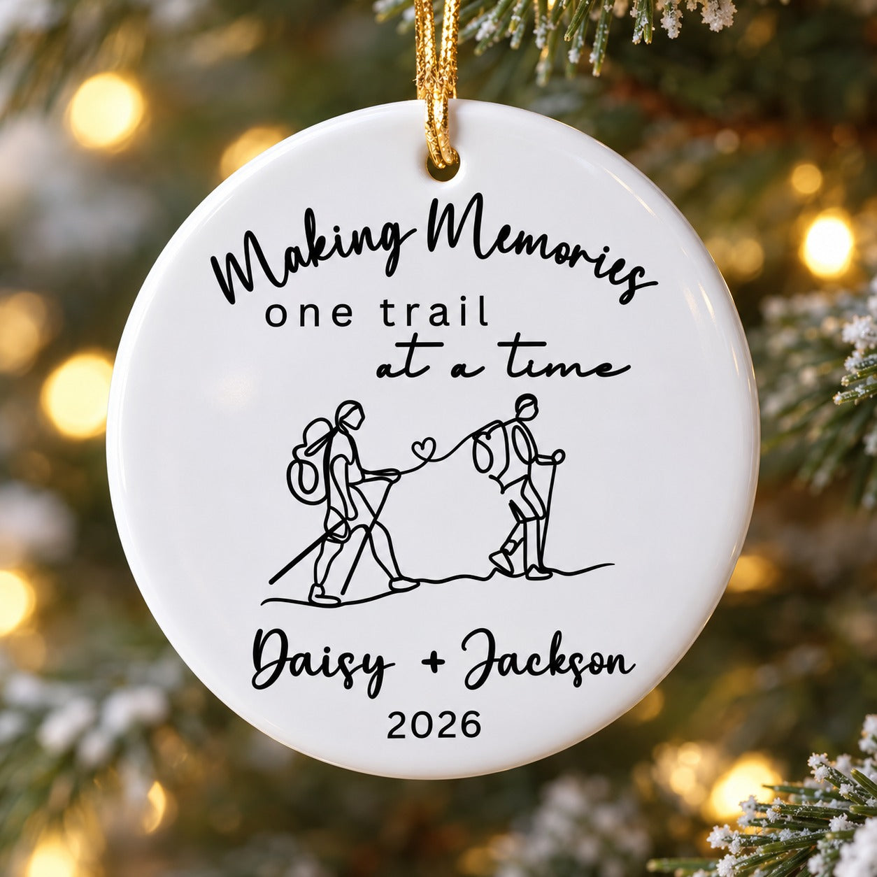 Close-up detail of the glossy ceramic finish and black line art on the hiking ornament