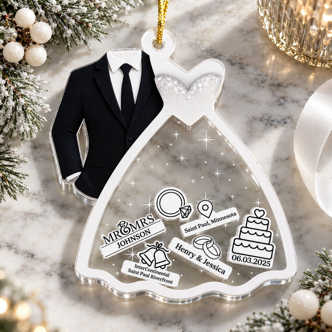 Christmas wedding shaker ornament lying flat on a holiday mantel with frosted pine