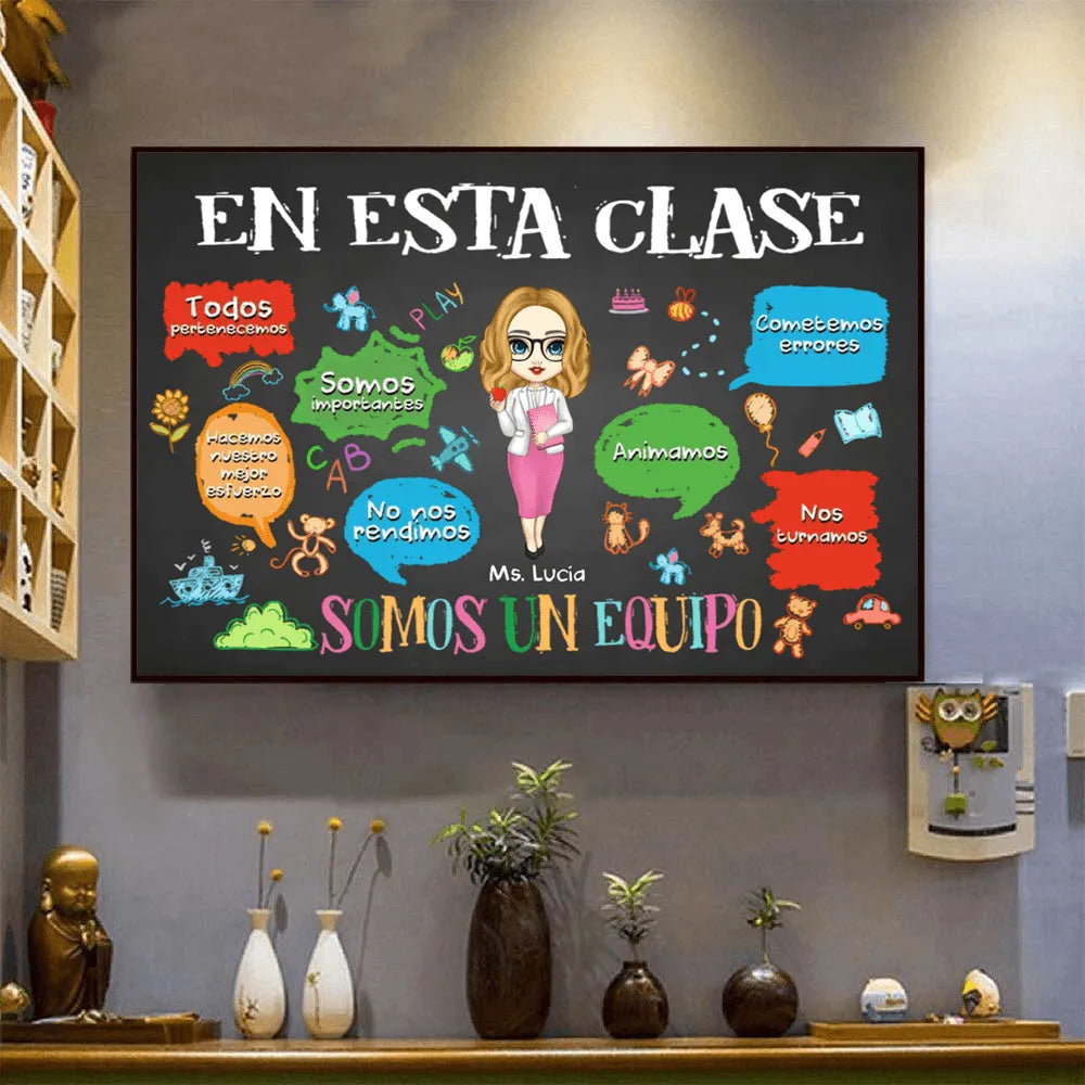 Personalized [Spanish Version] In This Classroom We Are A Team canvas print, a woman hanging the framed print on a wall
