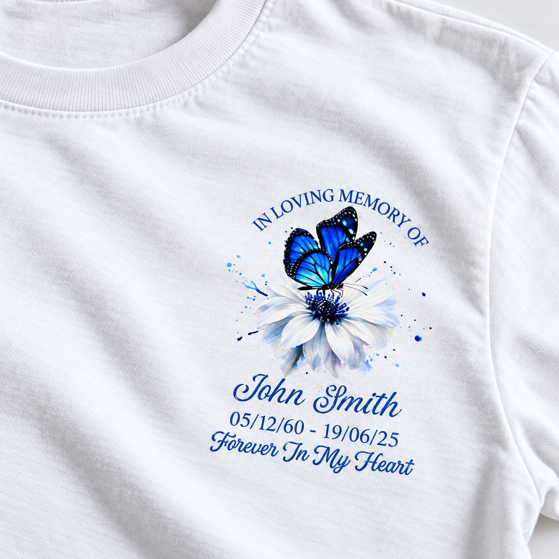 Close up detail of Memorial Butterfly Forever In My Heart print on white cotton shirt fabric