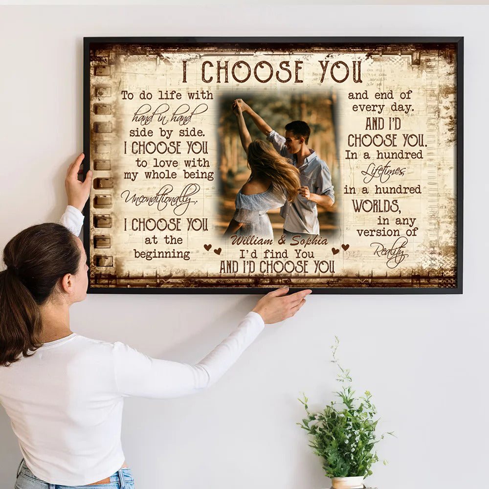 Custom Photo Couple I Choose You poster, a woman hanging the framed print on a wall