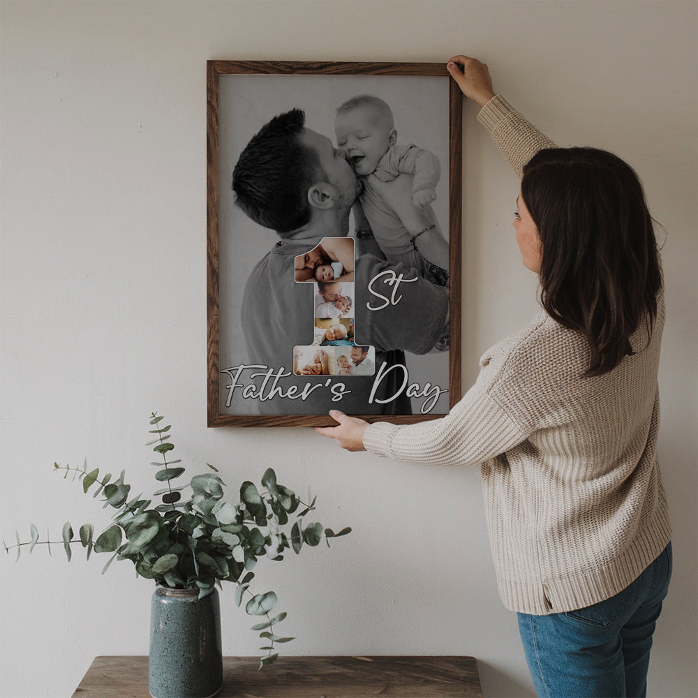 Custom Photo 1st Father's Day poster, a woman hanging the framed print on a wall