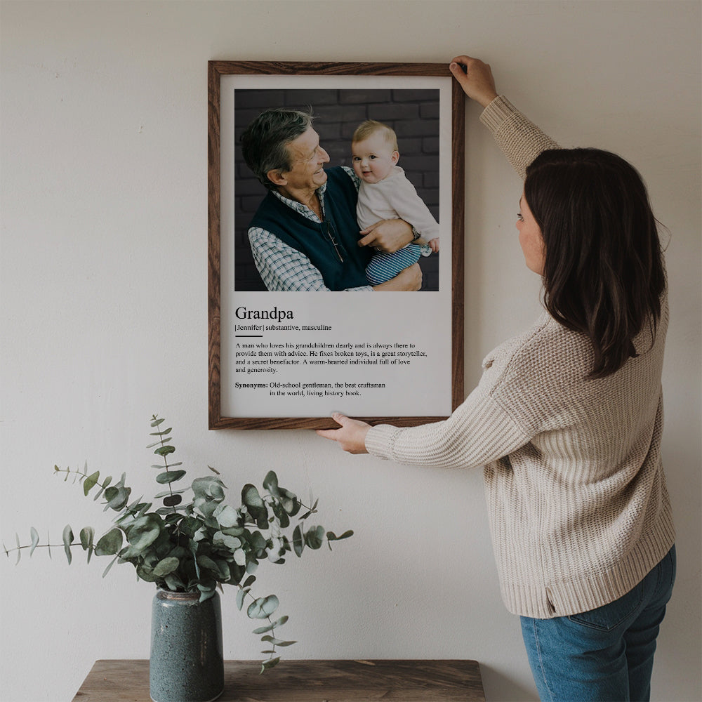 Custom Photo Grandpa Definition poster, a woman hanging the framed print on a wall