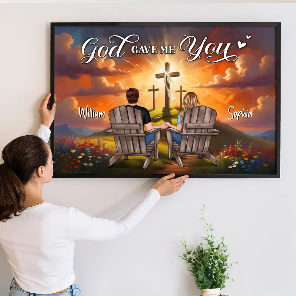 Personalized Cross God Gave Me You Couple Sitting poster, a woman hanging the framed print on a wall