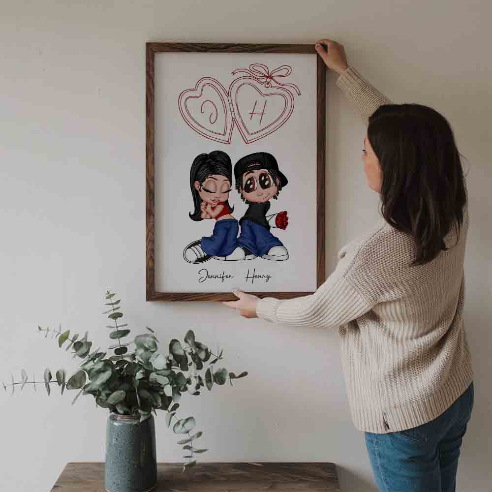 Personalized Y2K Couple Initial Heart Locket poster, a woman hanging the framed print on a wall