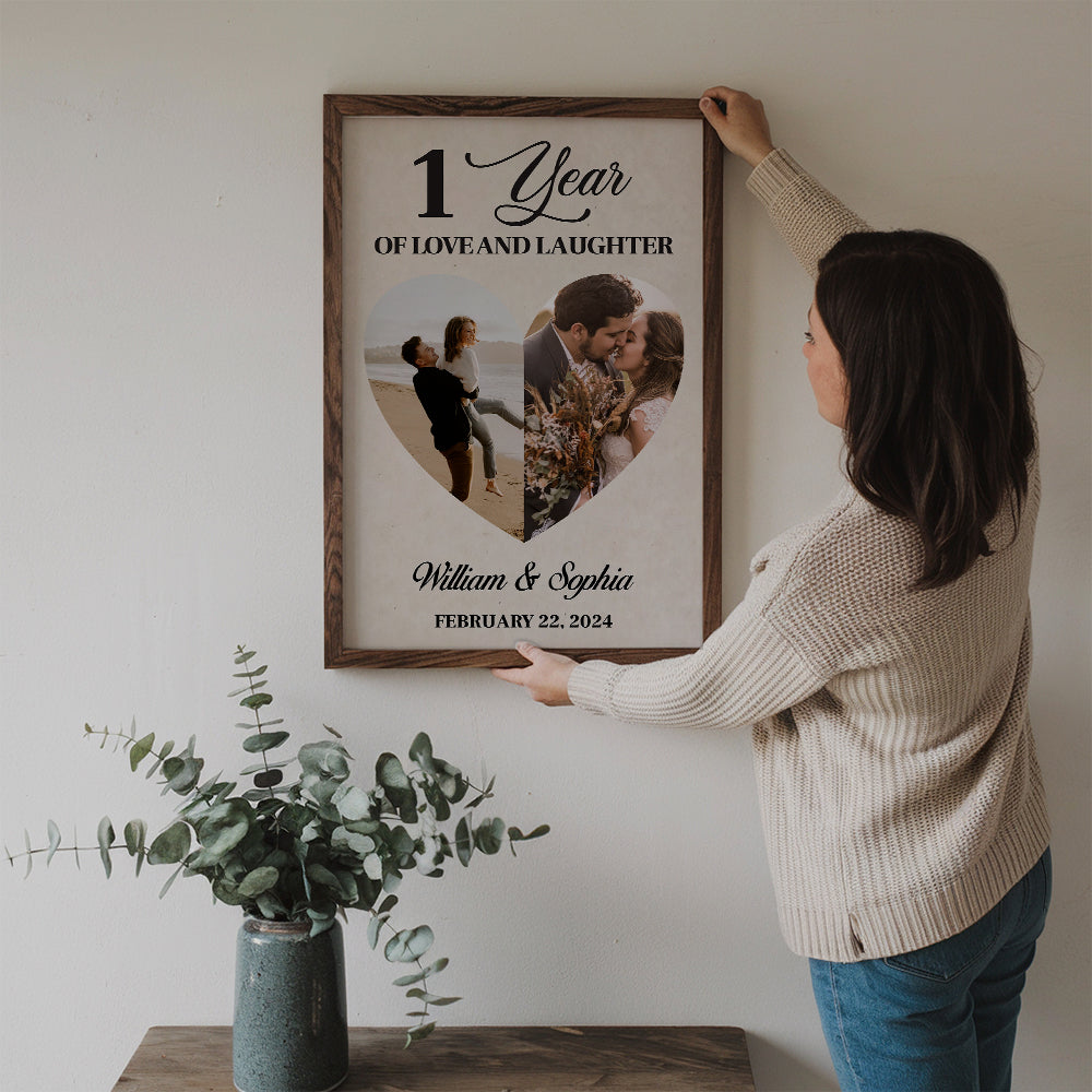 Custom Photo 1 Year Of Love And Laughter Couple poster, a woman hanging the framed print on a wall