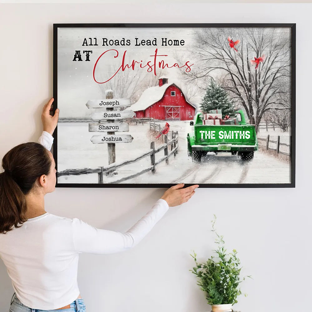Personalized All Roads Lead Home At Christmas poster, a woman hanging the framed print on a wall