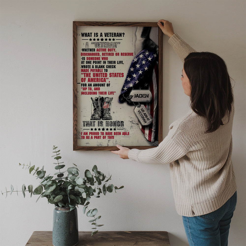 Personalized Name Proud Veteran poster, a woman hanging the framed print on a wall