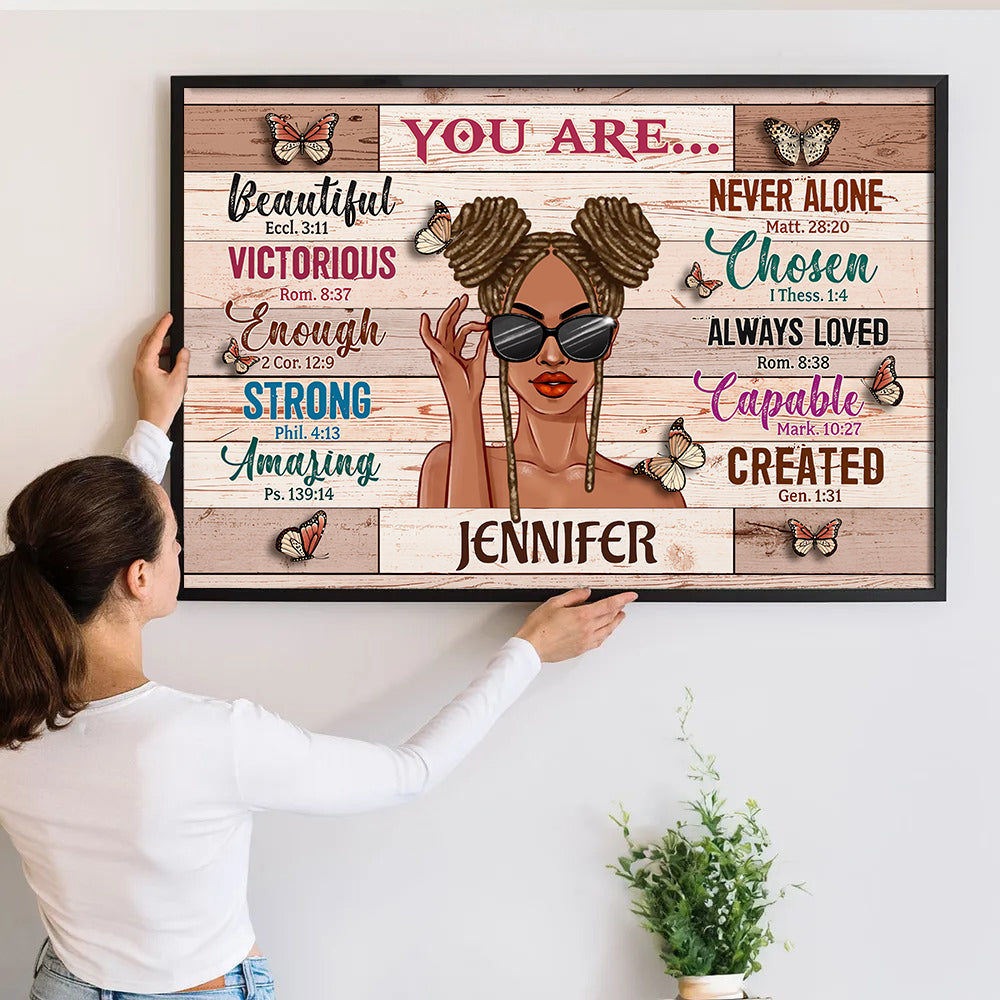Personalized You Are Beautiful Victorious poster, a woman hanging the framed print on a wall