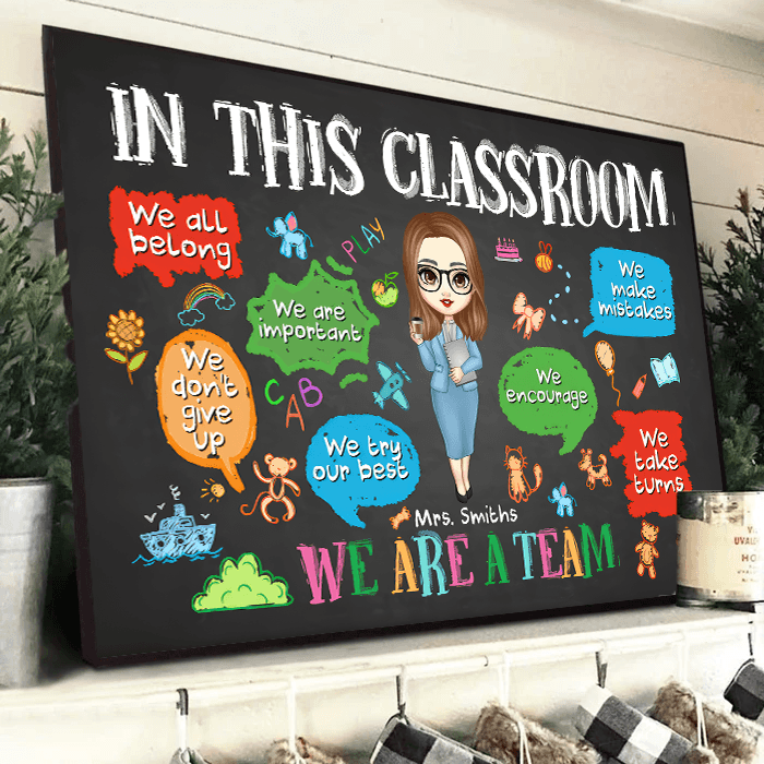 Personalized In This Classroom We Are A Team poster, a woman hanging the framed print on a wall