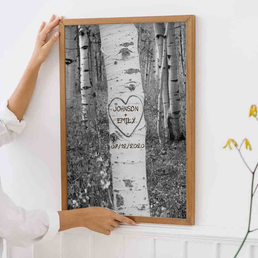 Personalized Couple Names Tree Carving poster, framed in a bright living room