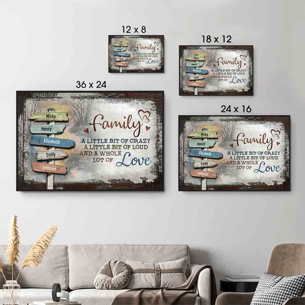 Family sign-post canvas "A little bit of crazy, a whole lot of love", size options shown on a sofa wall