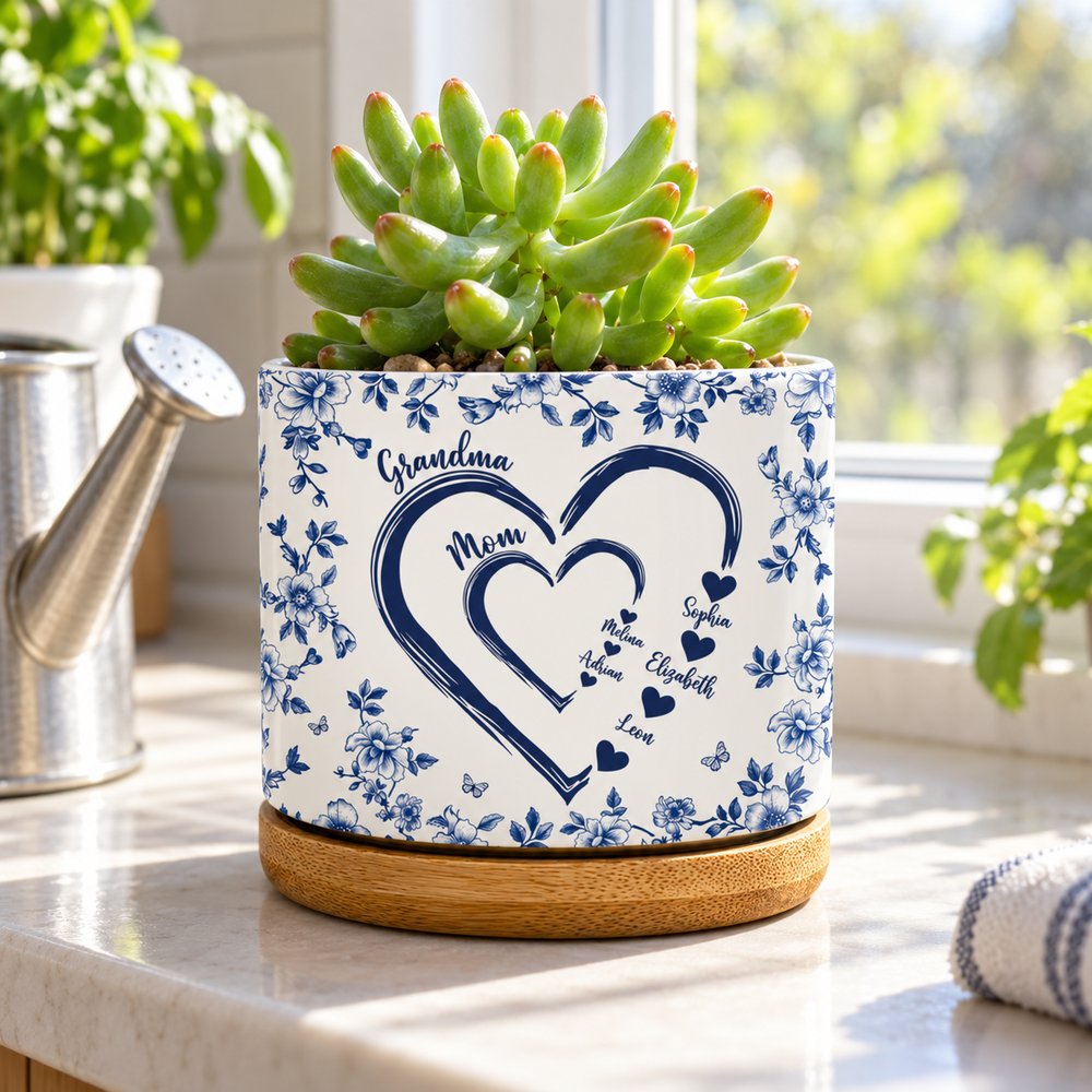 Personalized ceramic plant pot for Mom and Grandma displayed on a sunny windowsill