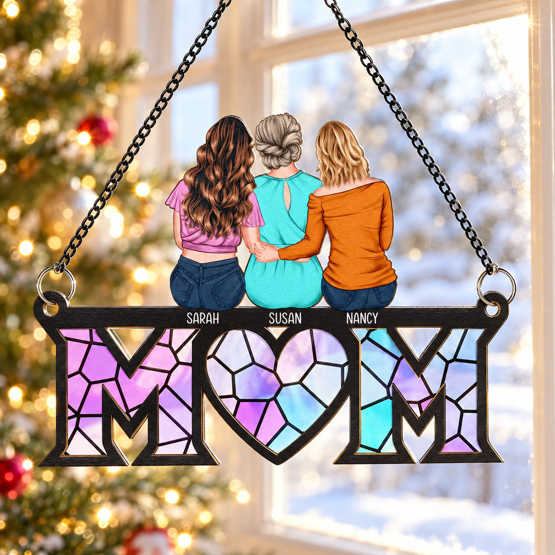 Personalized Mom suncatcher ornament displayed in a window with holiday decor in background