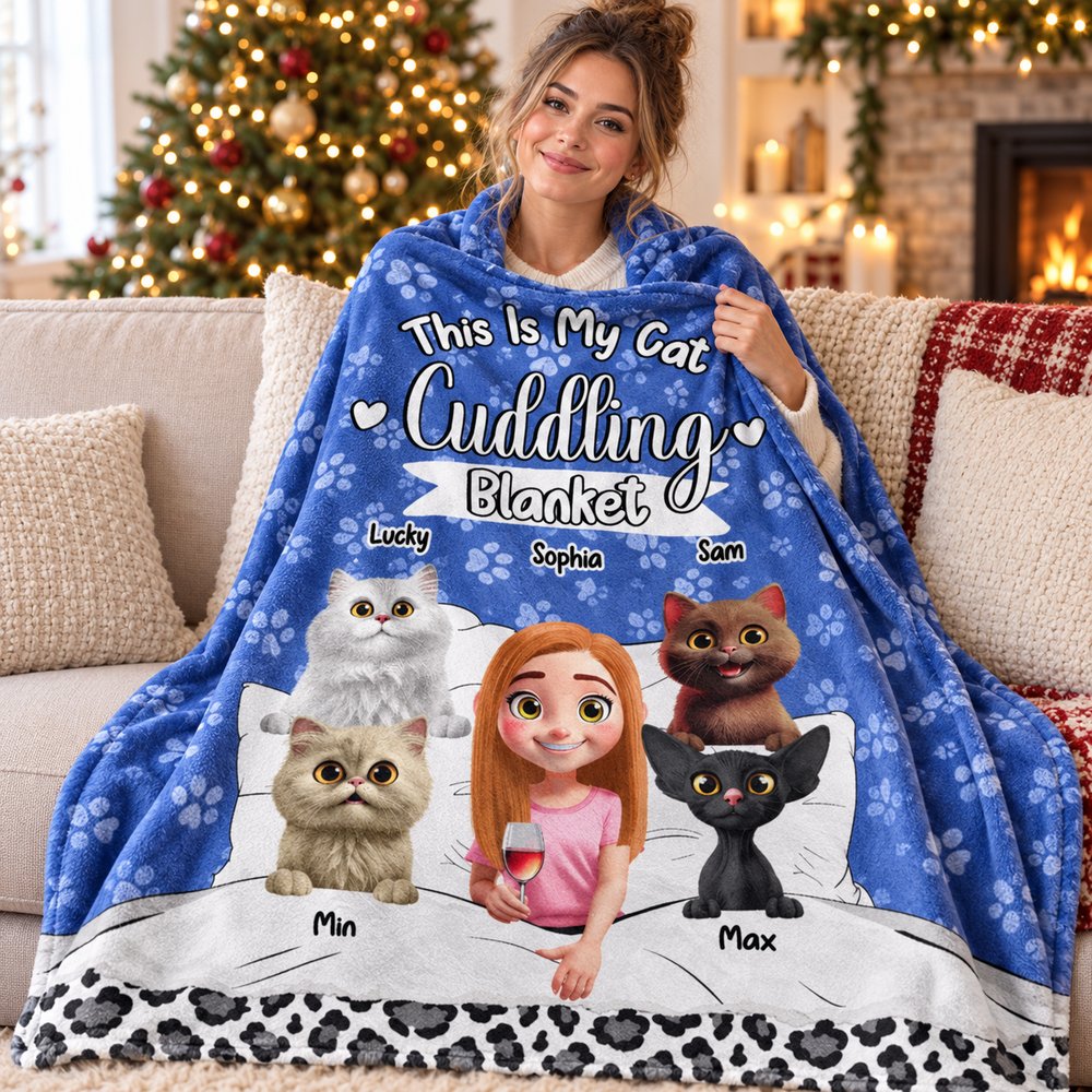 Custom cat cuddling fleece blanket wrapped around a woman on a sofa near a Christmas tree
