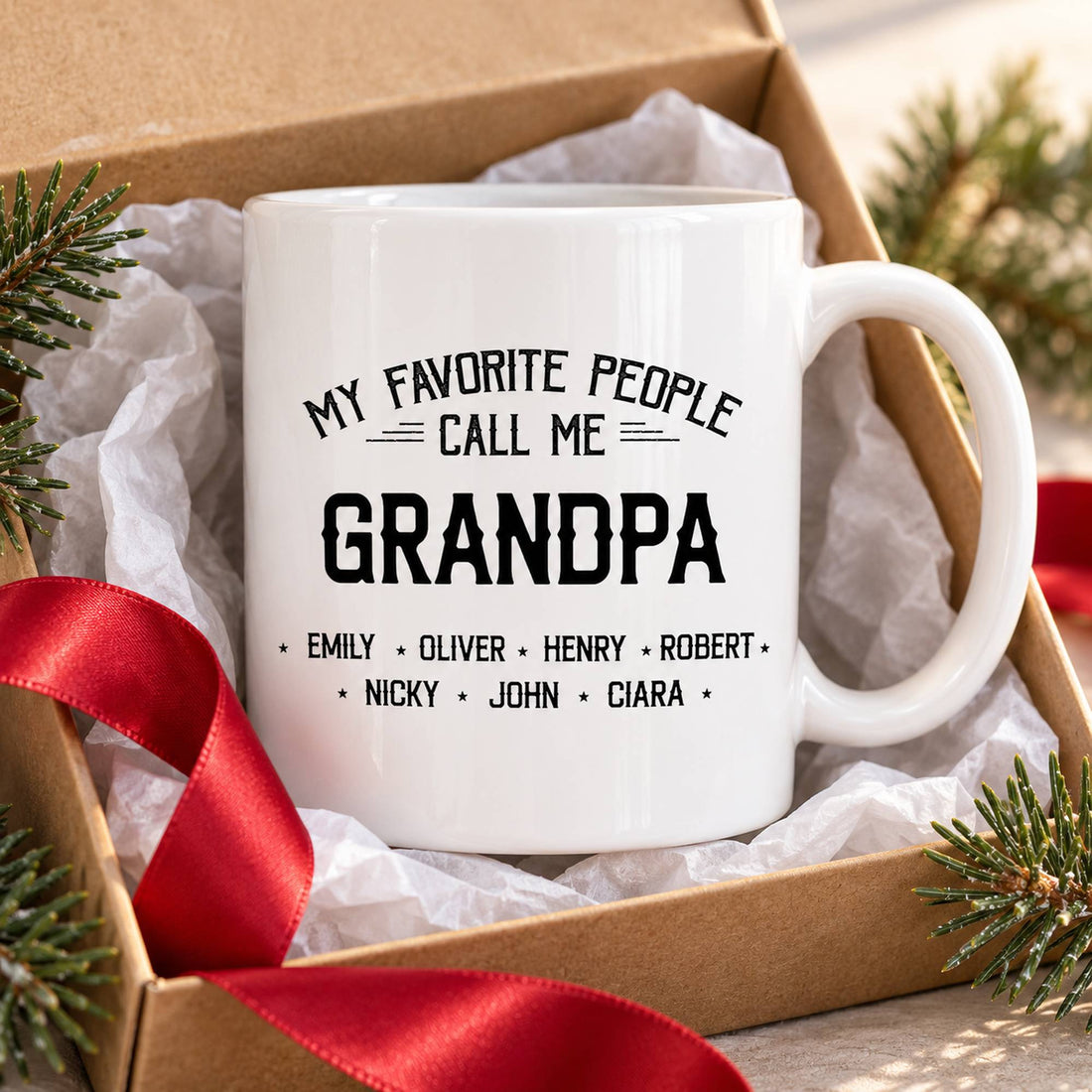 Custom Grandpa name mug presented in an open holiday gift box with tissue paper and red ribbon
