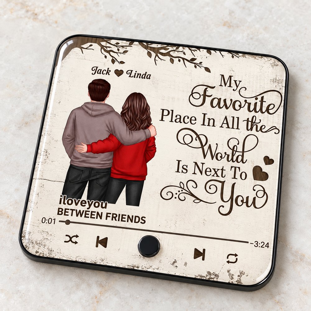Close-up detail of acrylic surface and physical play button on the couple music fridge magnet