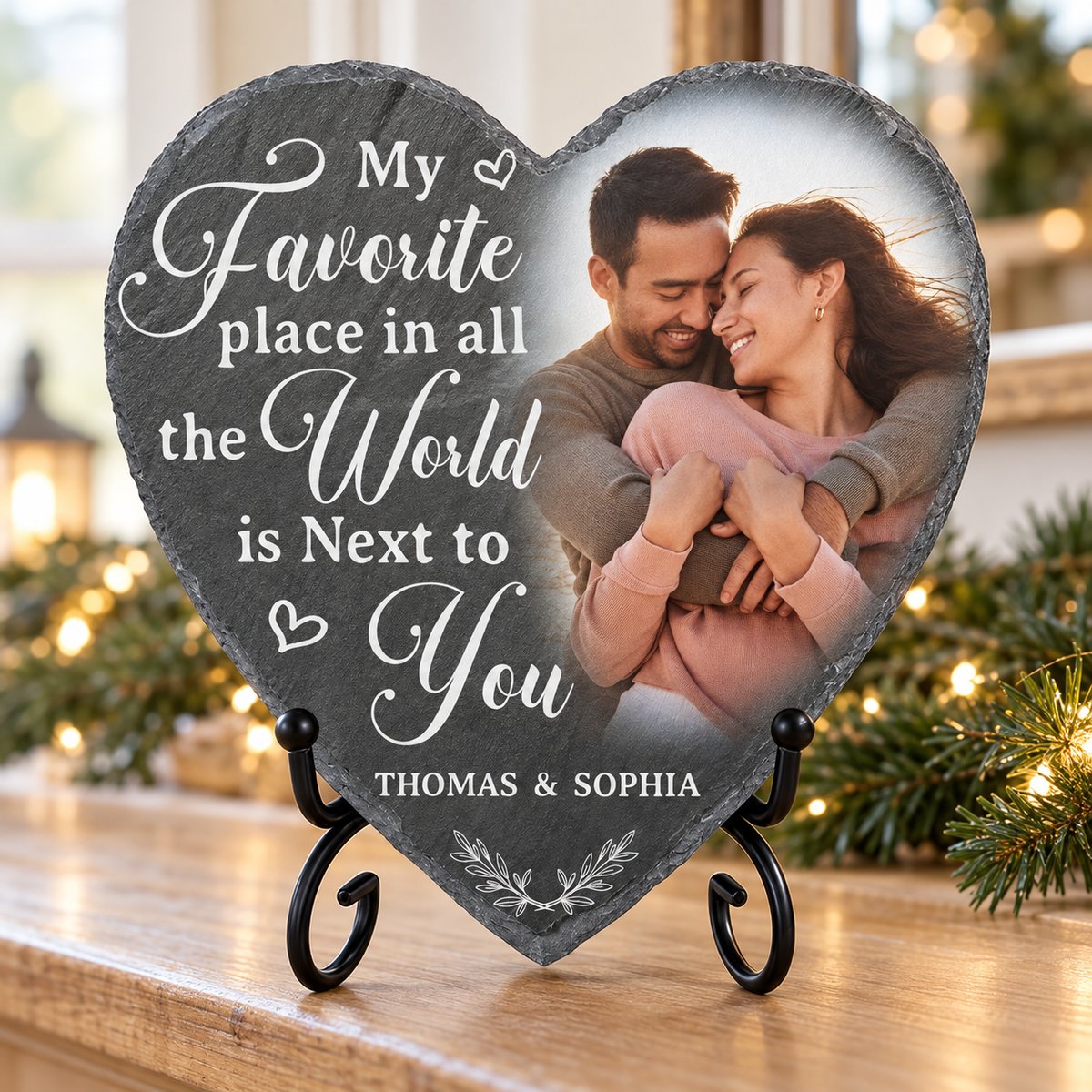 Personalized heart shaped slate stone on stand displayed on holiday mantel with pine garland