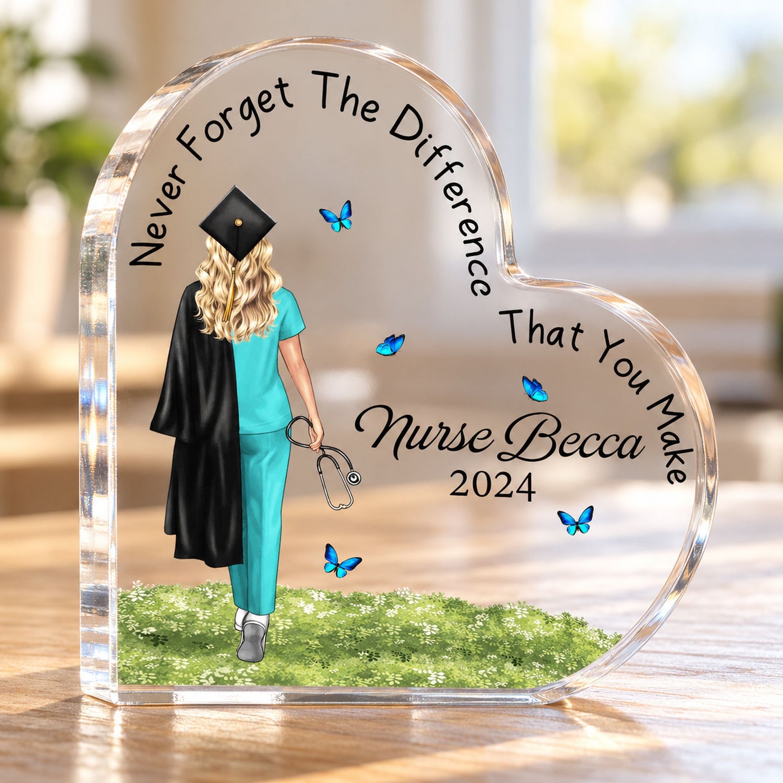 Close-up detail of thick clear acrylic heart plaque showing nurse graduation print