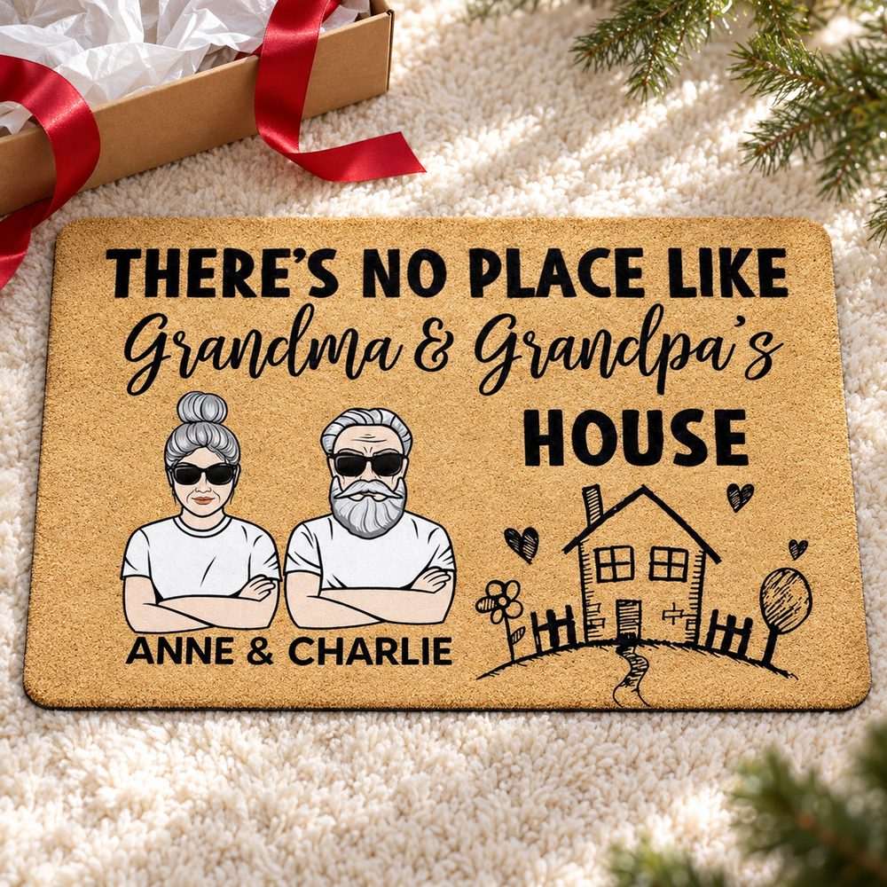 Personalized Grandma and Grandpa doormat displayed as a Christmas gift with ribbon