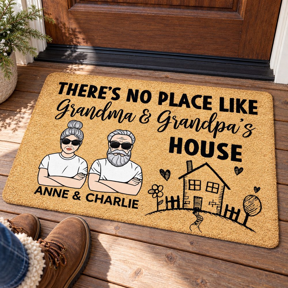 Personalized Grandma and Grandpa house doormat in use on a wooden porch