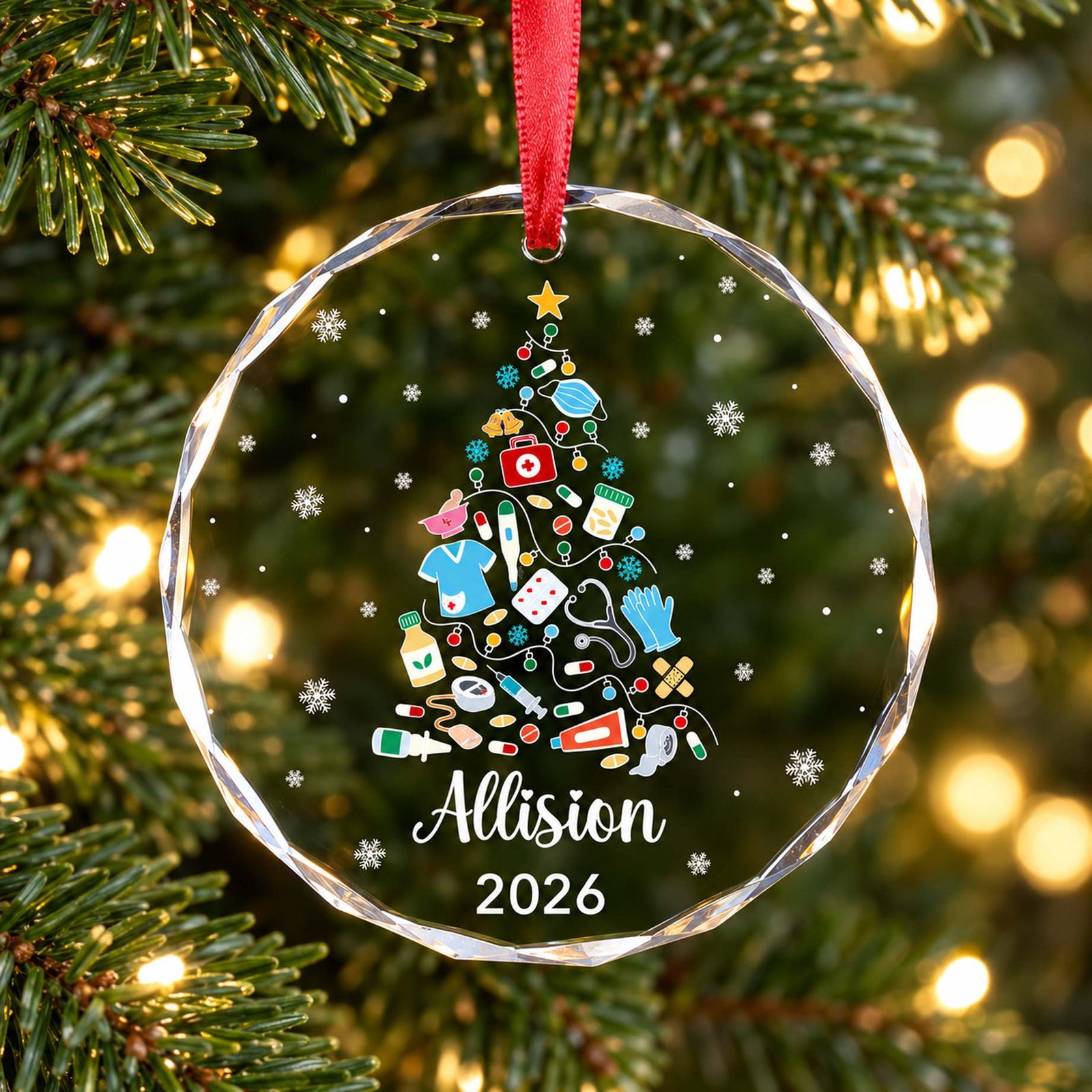 Personalized nurse glass Christmas ornament Allision 2026 hanging on a festive pine tree branch
