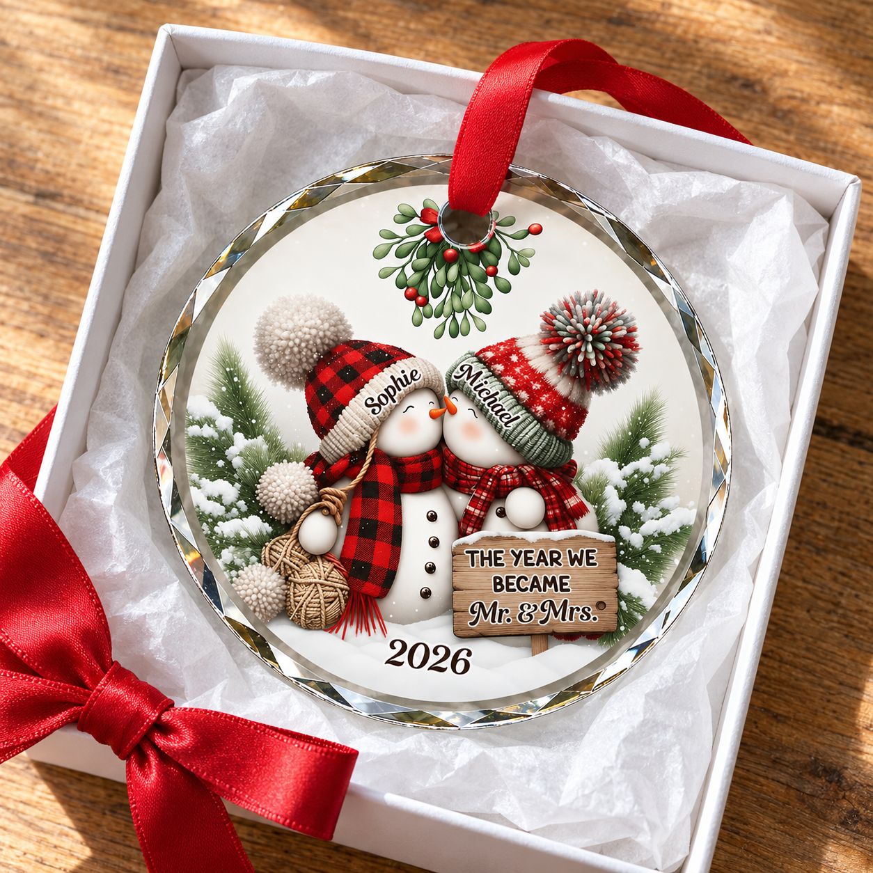 Our 1st Married Christmas glass ornament presented in a holiday gift box with tissue paper