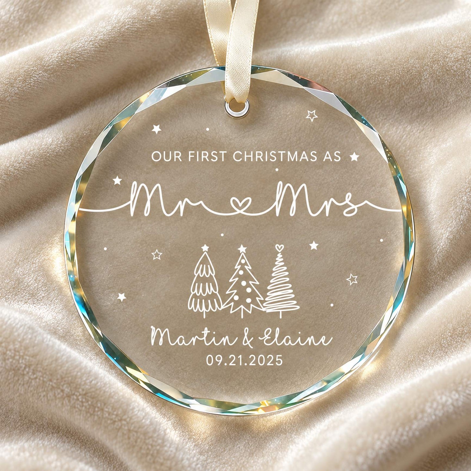 Macro close-up of Our First Christmas as Mr and Mrs beveled glass ornament showing faceted edge and white print