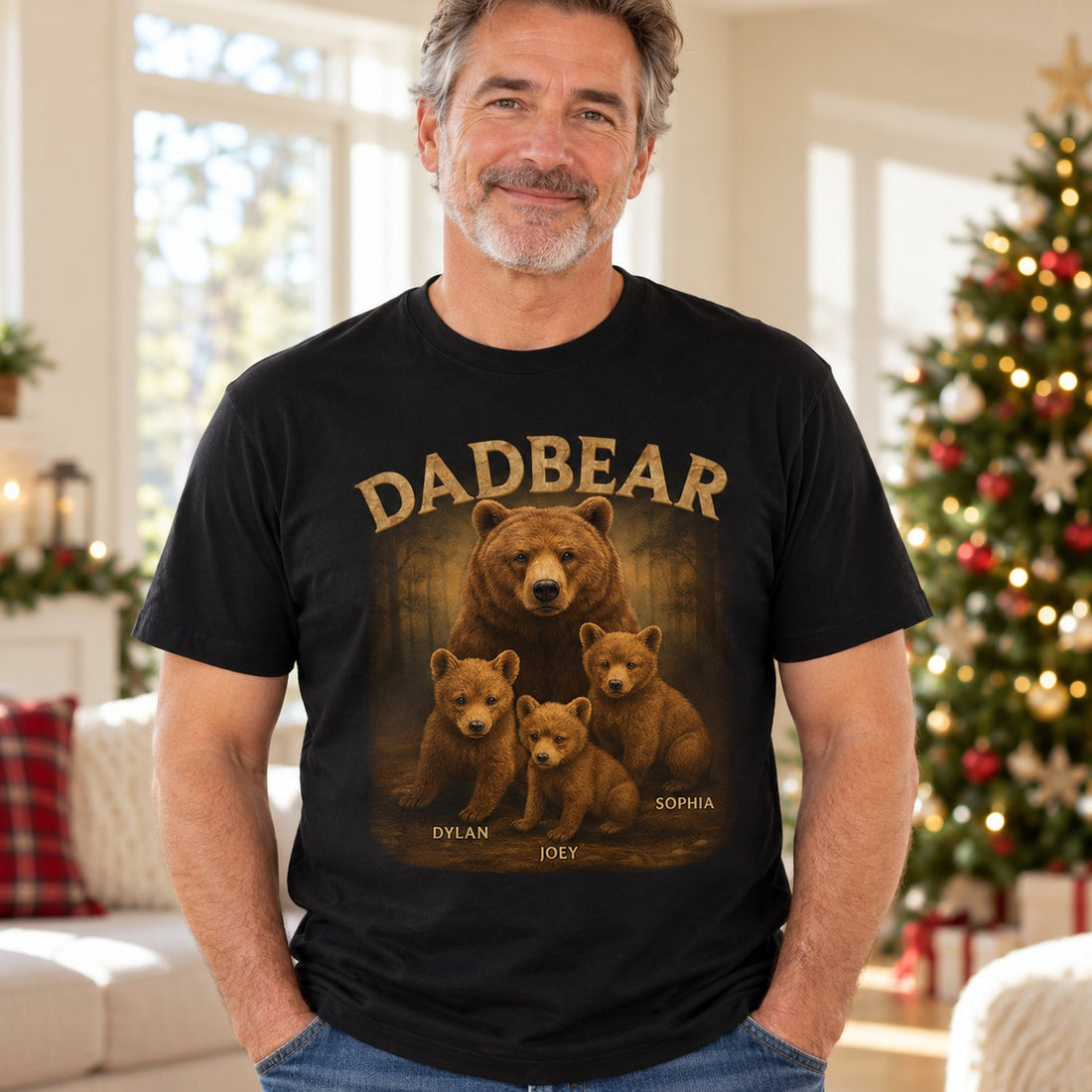 Dad wearing personalized Dadbear t-shirt with cub names in a bright holiday living room