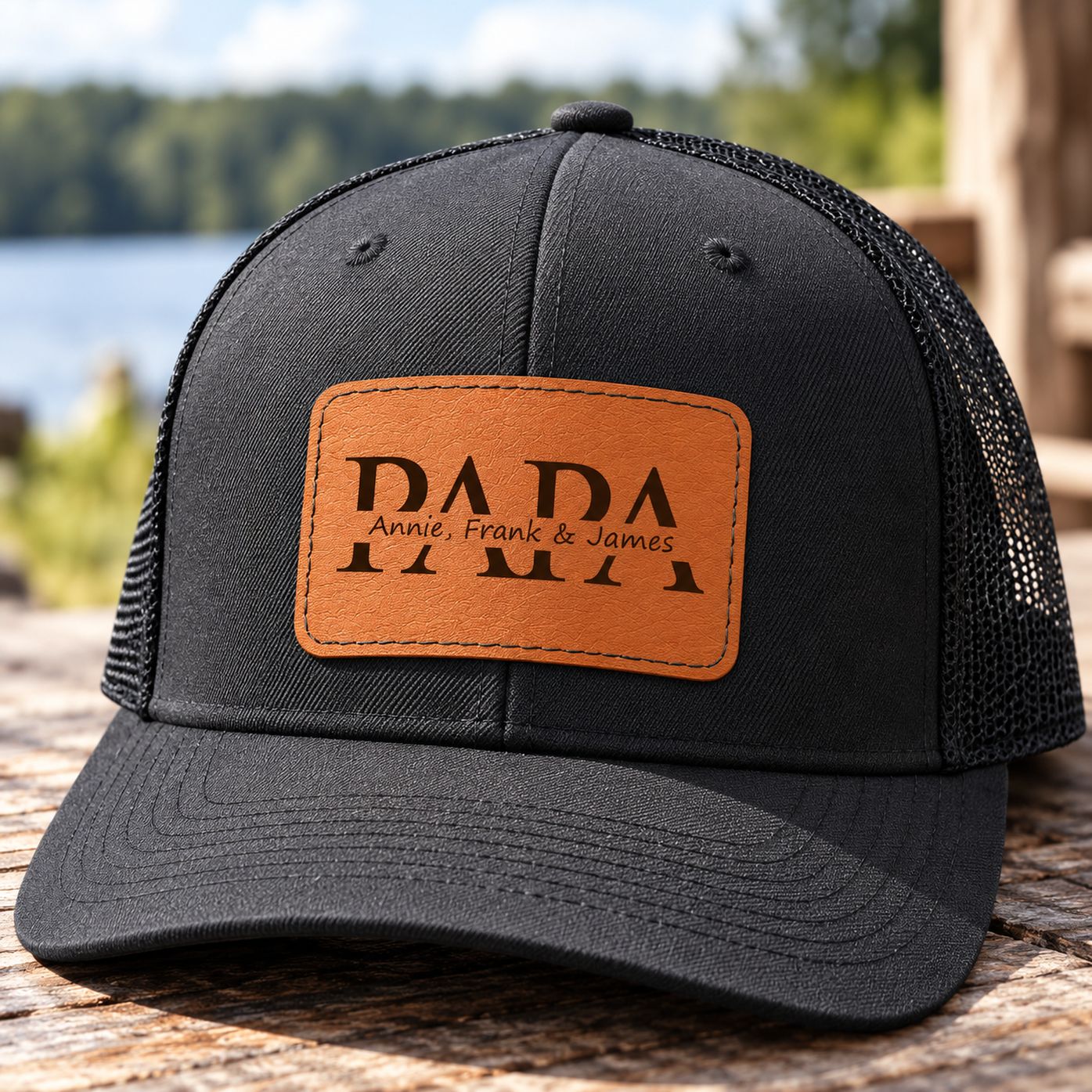 Macro closeup of stitched brown leather patch with PAPA and custom kids names on hat