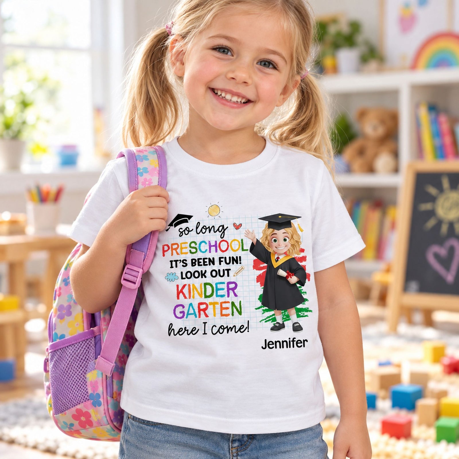 Child wearing custom Pre-K graduation Kindergarten Here I Come shirt in a sunny playroom