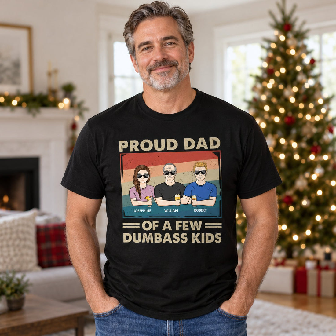 Dad wearing black personalized Proud Dad of a Few Kids t-shirt in a bright holiday living room