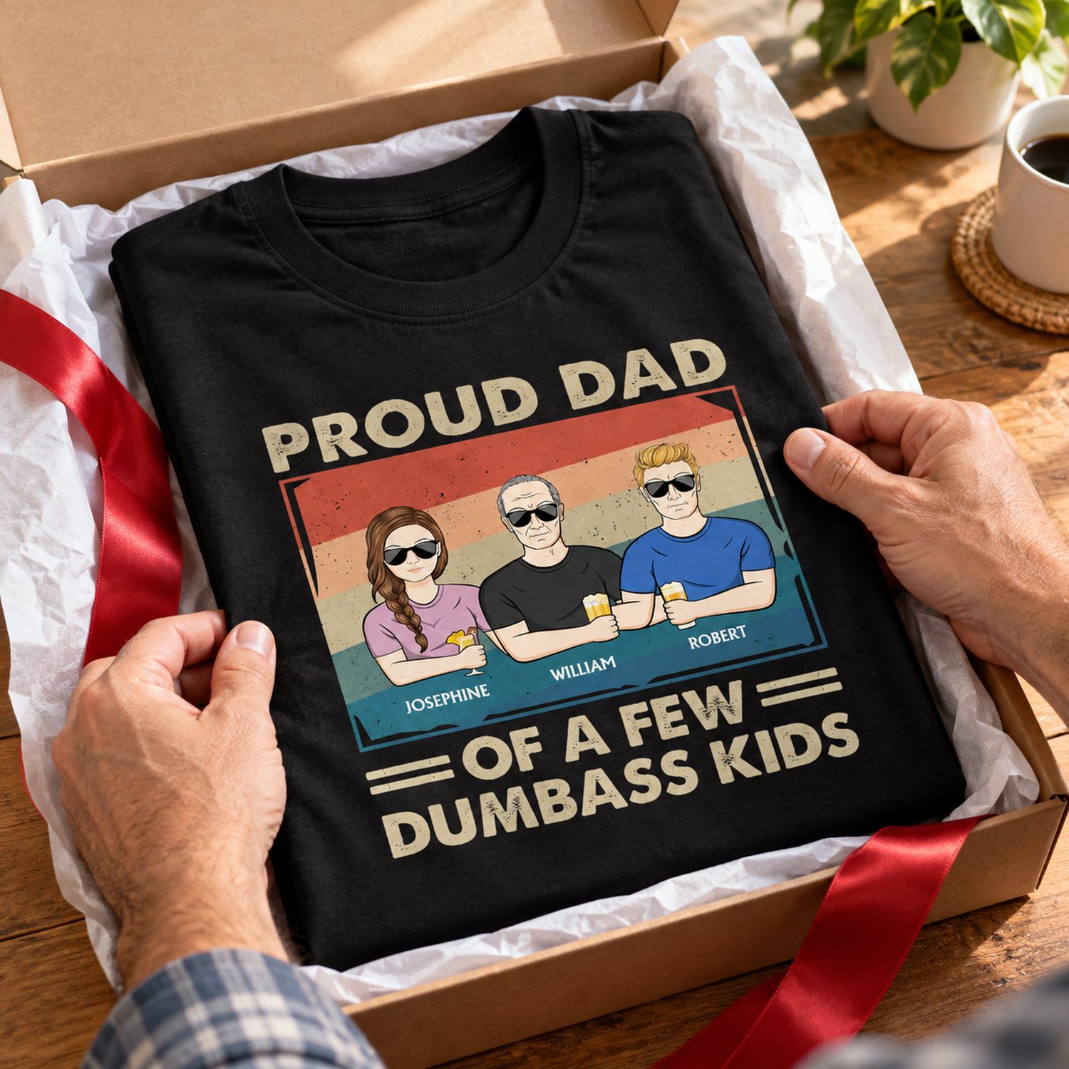 Personalized Proud Dad custom t-shirt in an open holiday gift box with ribbon being unwrapped