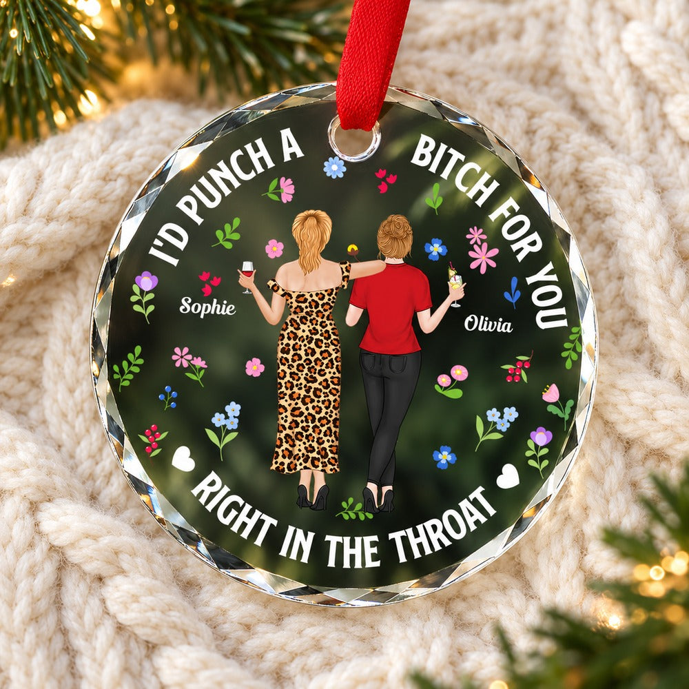 Punch Bitch Besties personalized glass ornament lying flat on a cozy cream knit blanket
