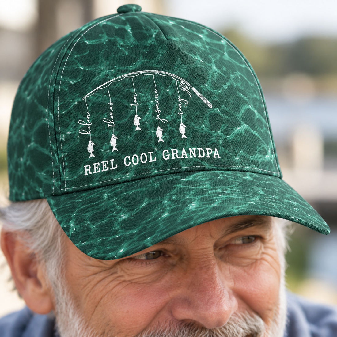 Close-up detail of Reel Cool Grandpa classic cap fabric texture and personalized fish print