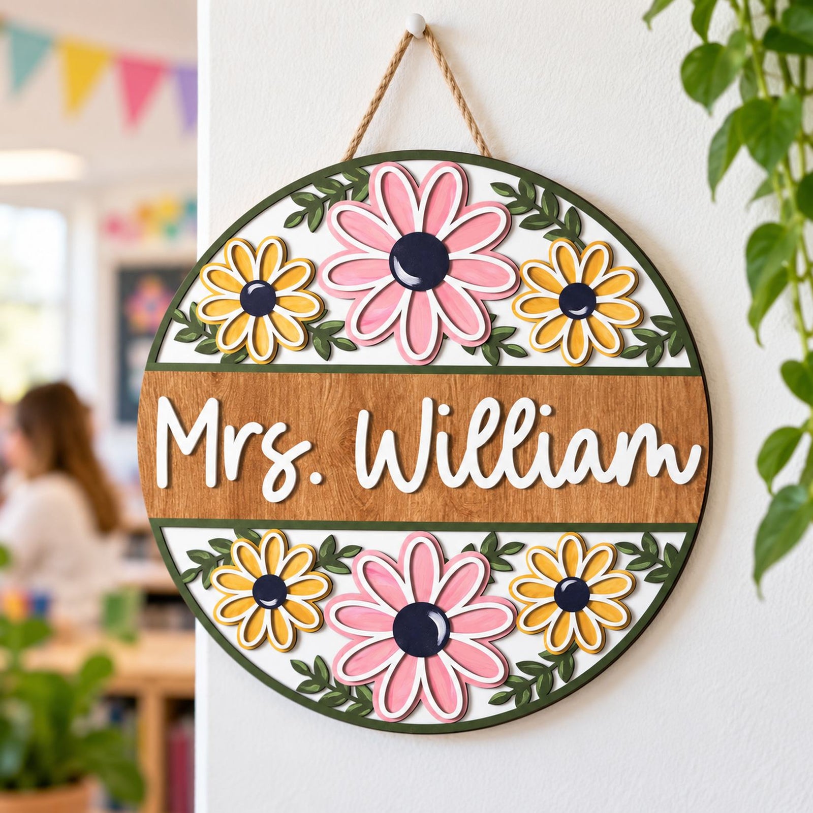 Retro Floral Teacher Door Sign Mrs. William hanging on a bright classroom wall