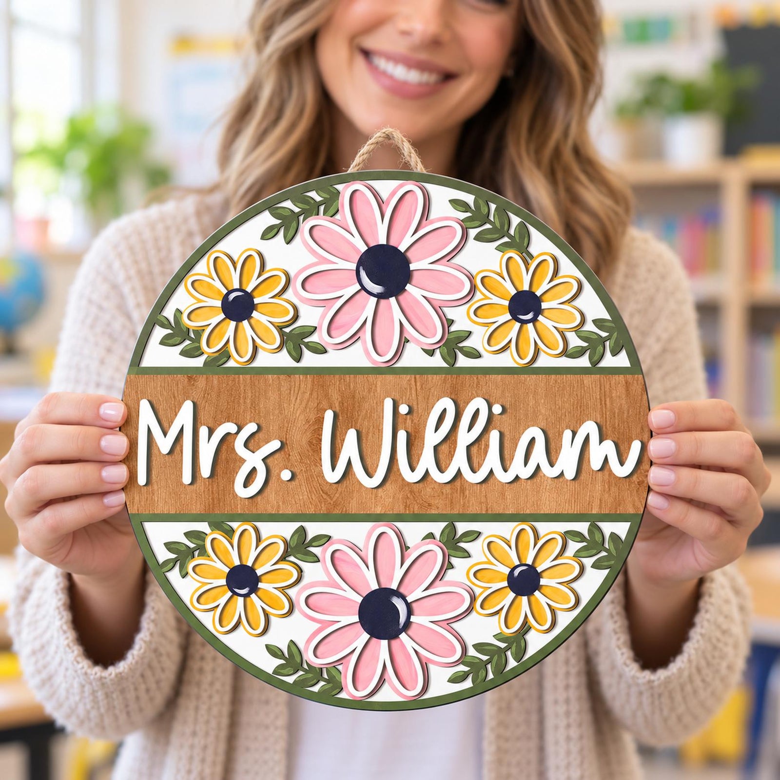 Female teacher holding personalized Mrs. William retro floral round wood sign