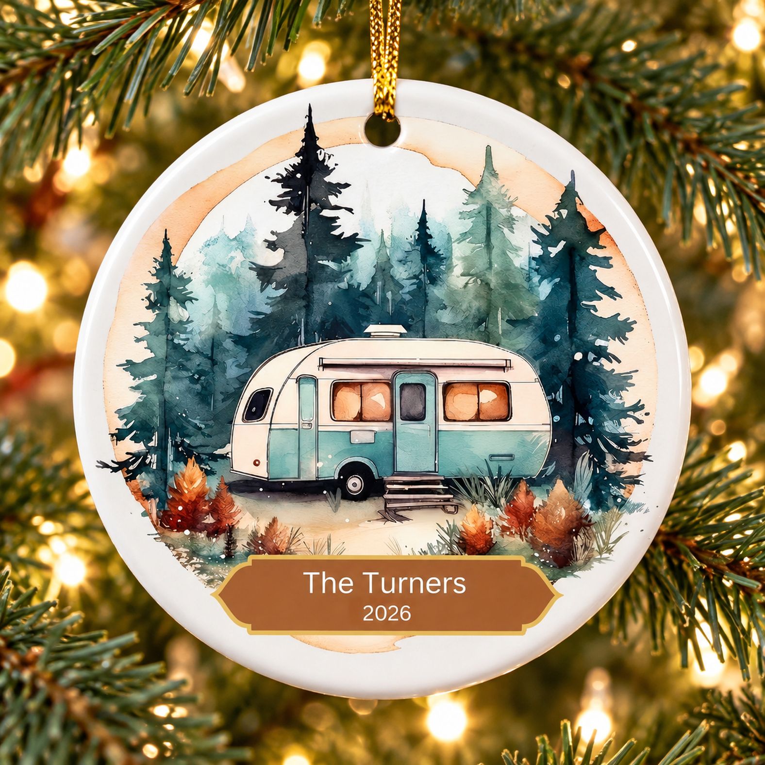 Personalized RV camping circle ceramic ornament hanging on a Christmas tree branch