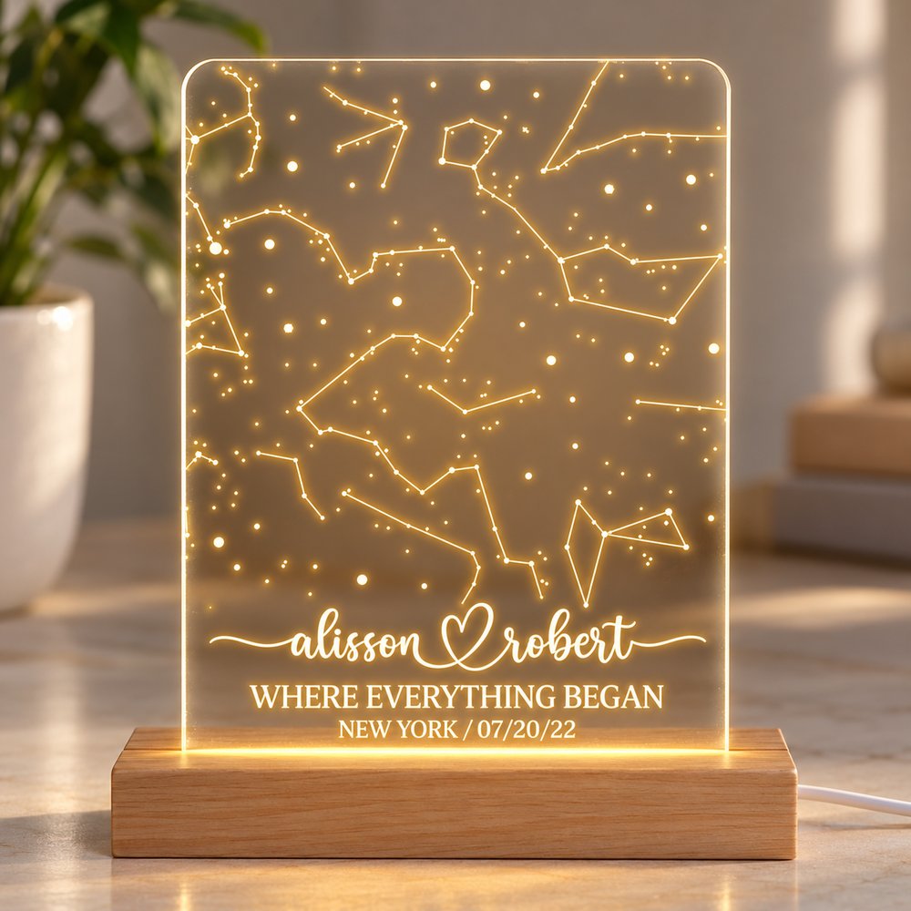 Close-up of laser engraved star map and couple names on glowing acrylic LED lamp