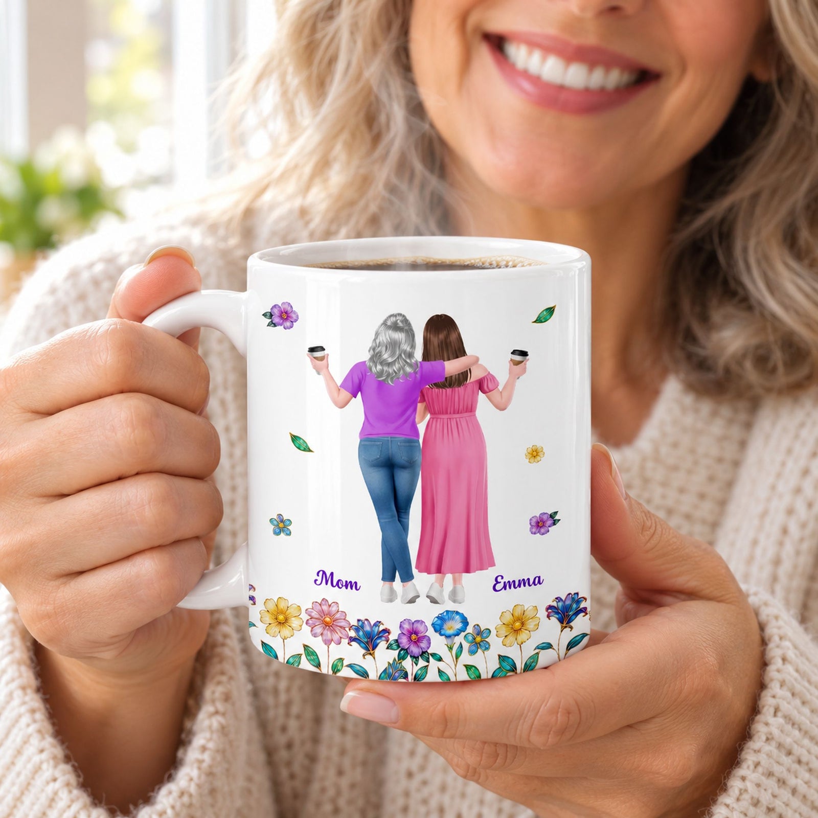 Smiling mom holding personalized mother daughter coffee mug with steam