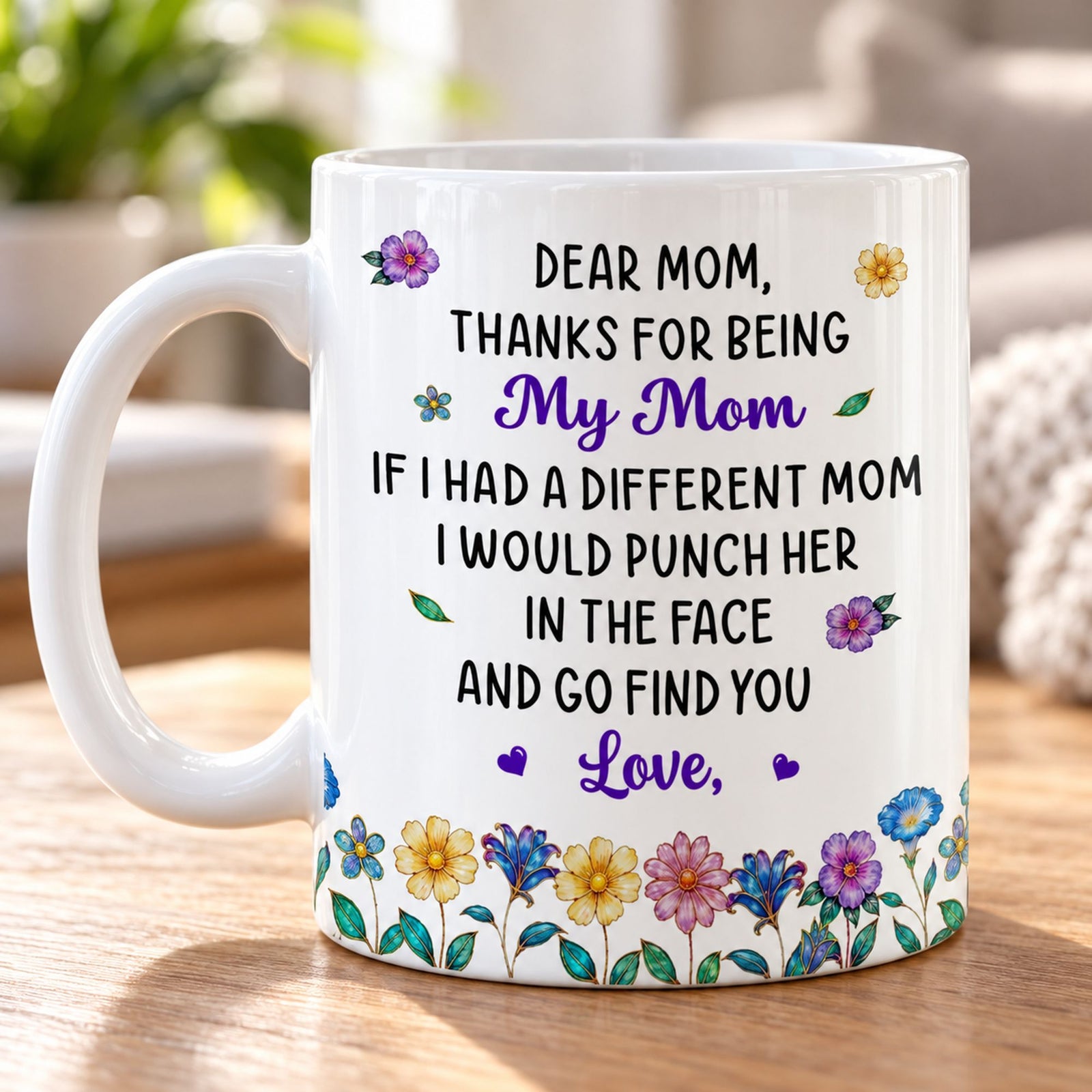Close up detail of glossy ceramic print and floral border on Mom mug
