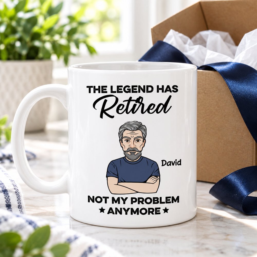 Custom retirement coffee mug presented next to an open gift box with tissue paper and ribbon