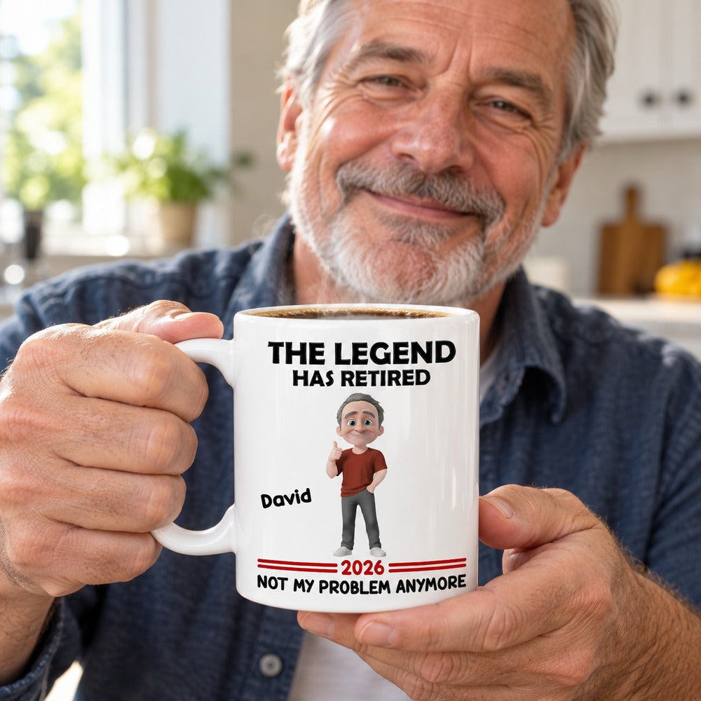 Retired man holding personalized The Legend Has Retired ceramic coffee mug with steam