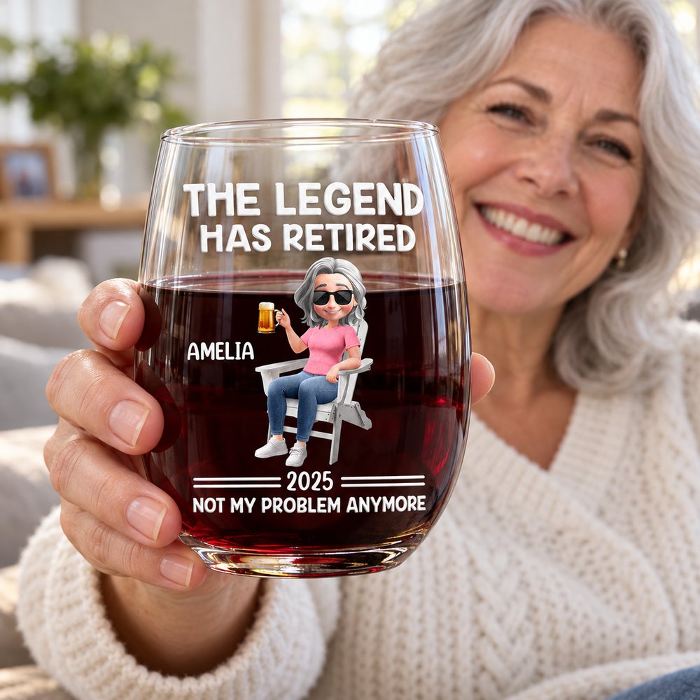 Retired woman holding personalized The Legend Has Retired stemless wine glass