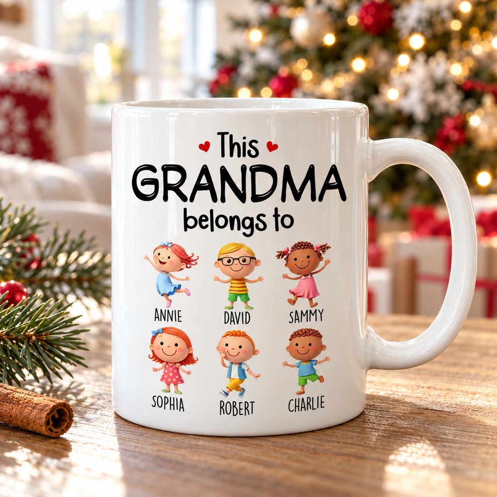 This Grandma Belongs To custom mug on coffee table with softly blurred Christmas tree background