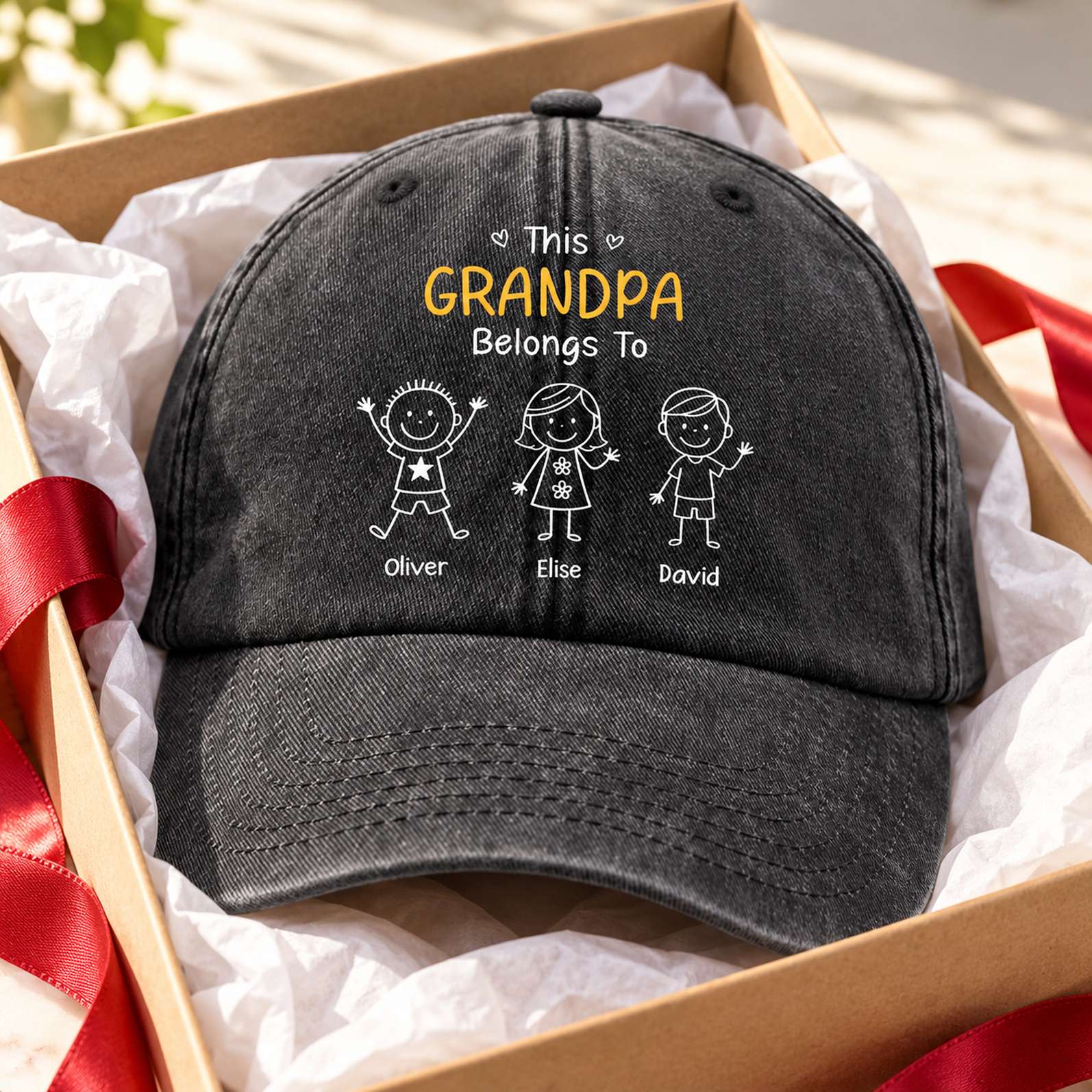Custom Grandpa Belongs To denim cap presented in a holiday gift box with tissue paper
