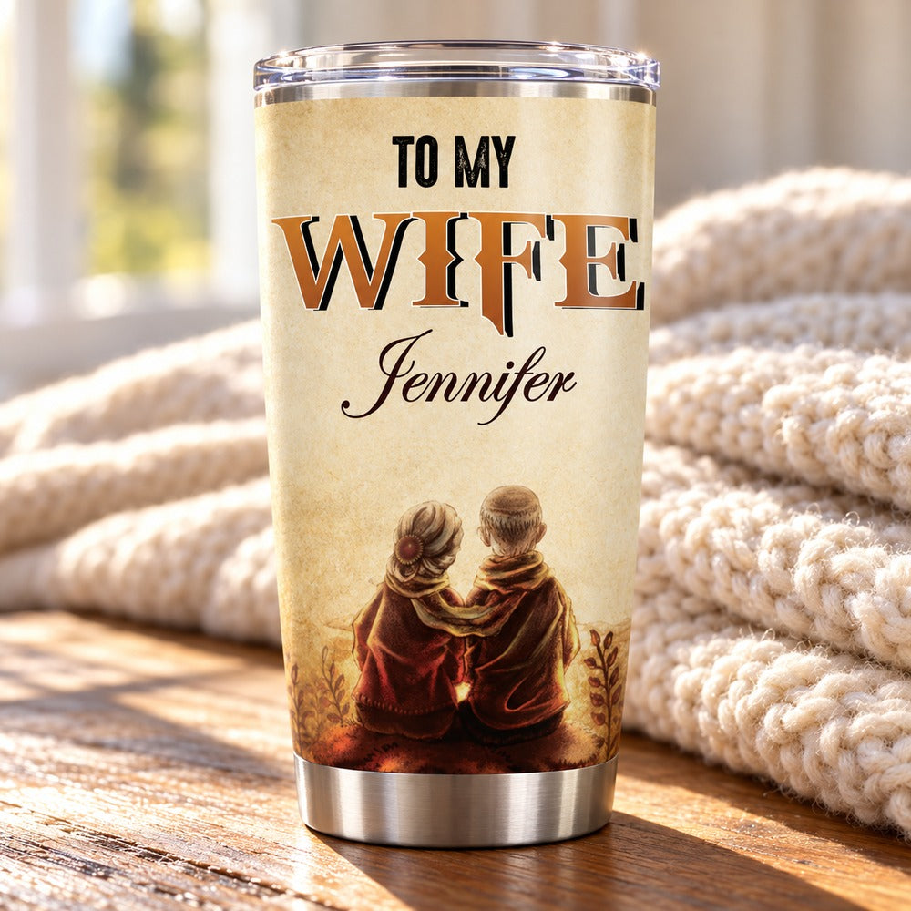 Custom To My Wife Jennifer 20oz tumbler on wooden side table with cozy knit blanket